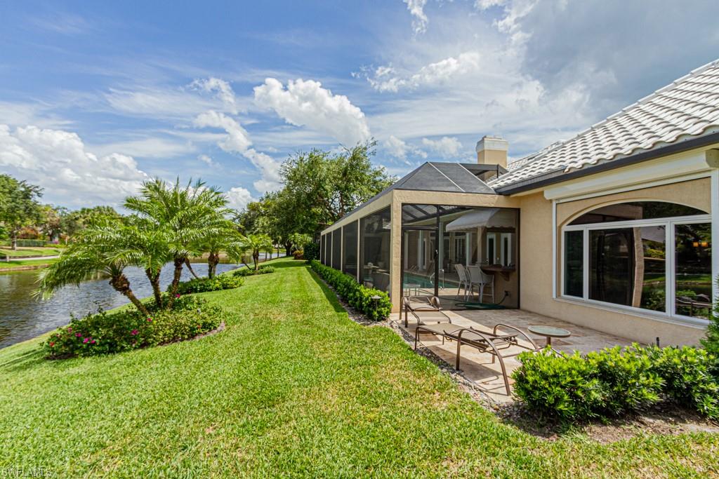6974 Green Tree Drive Naples, FL 34108 - Photo 30 of 32 a view of a house with backyard and garden