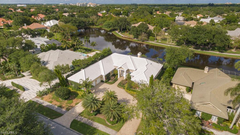 6974 Green Tree Drive Naples, FL 34108 - Photo 5 of 32 an aerial view of residential houses with outdoor space