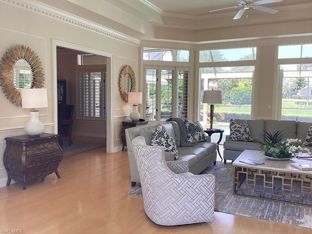 6974 Green Tree Drive Naples, FL 34108 - Photo 8 of 32 a living room with furniture and a large window