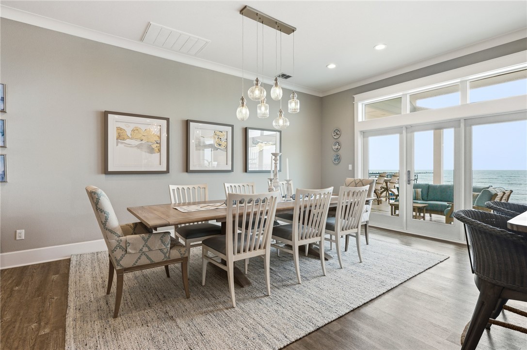 12 Sea Shell Shores Rockport, TX 78382 - Photo 7 of 40 a view of a dining room with furniture window and wooden floor