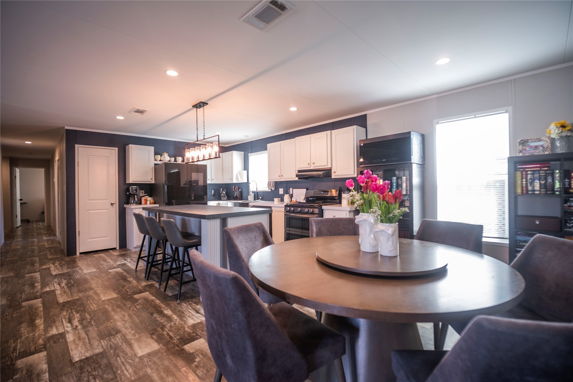 5402 Five Oaks Drive Spring, TX 77389 - Photo 2 of 20 a kitchen with a dining table chairs and refrigerator