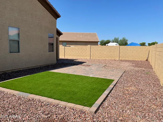 a view of a backyard of the house