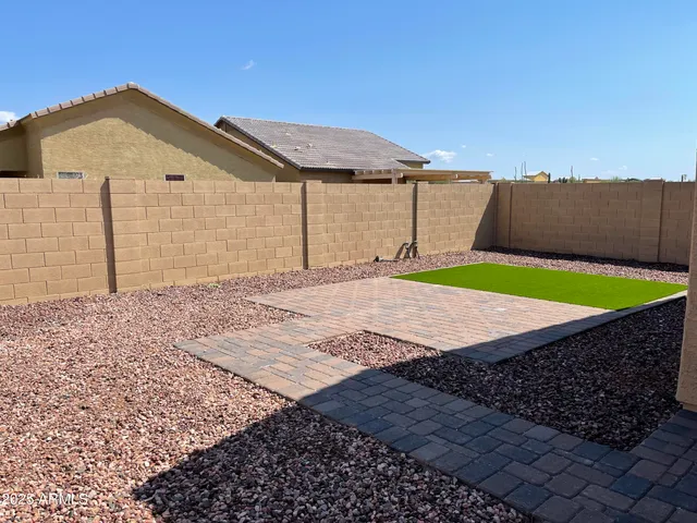 a view of a backyard of the house