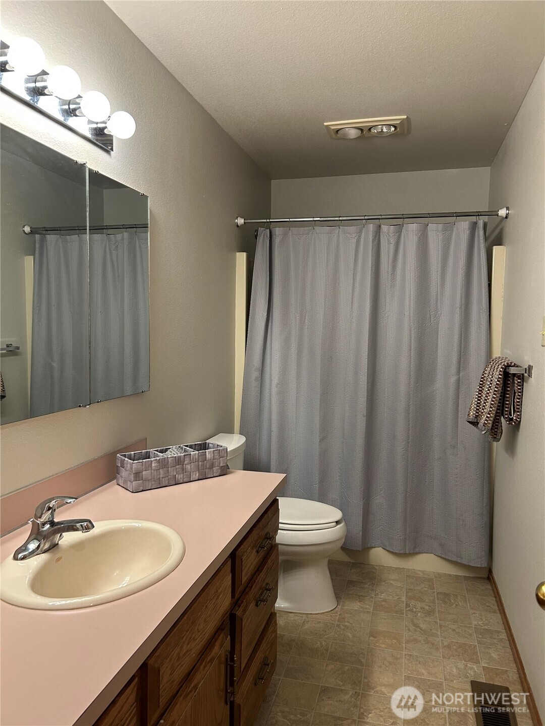 6850 Raspberry Dr., Unit A Everson, WA 98247 - Photo 11 of 22 a bathroom with a sink a toilet and shower