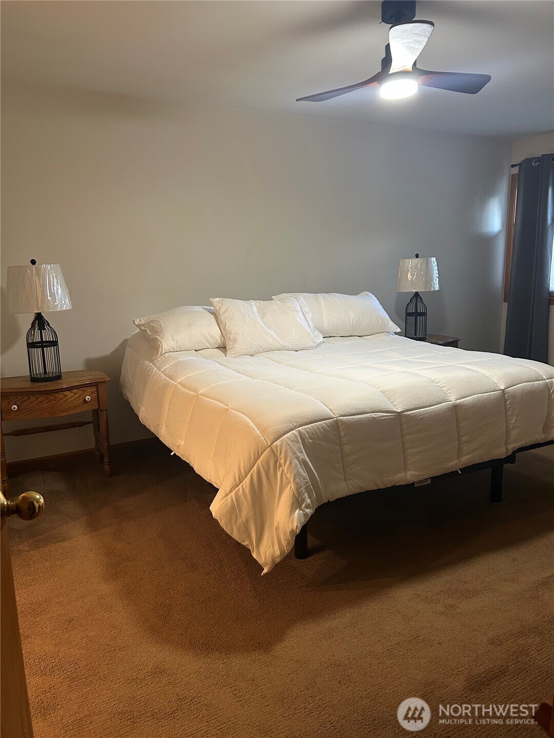 6850 Raspberry Dr., Unit A Everson, WA 98247 - Photo 13 of 22 a bedroom with a bed and lamp