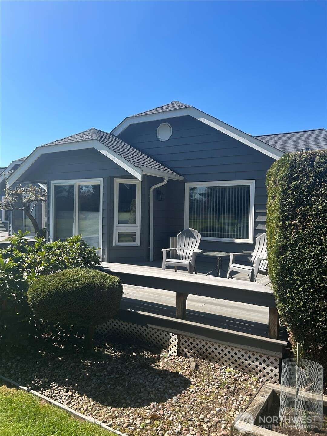 6850 Raspberry Dr., Unit A Everson, WA 98247 - Photo 19 of 22 a front view of a house with a yard