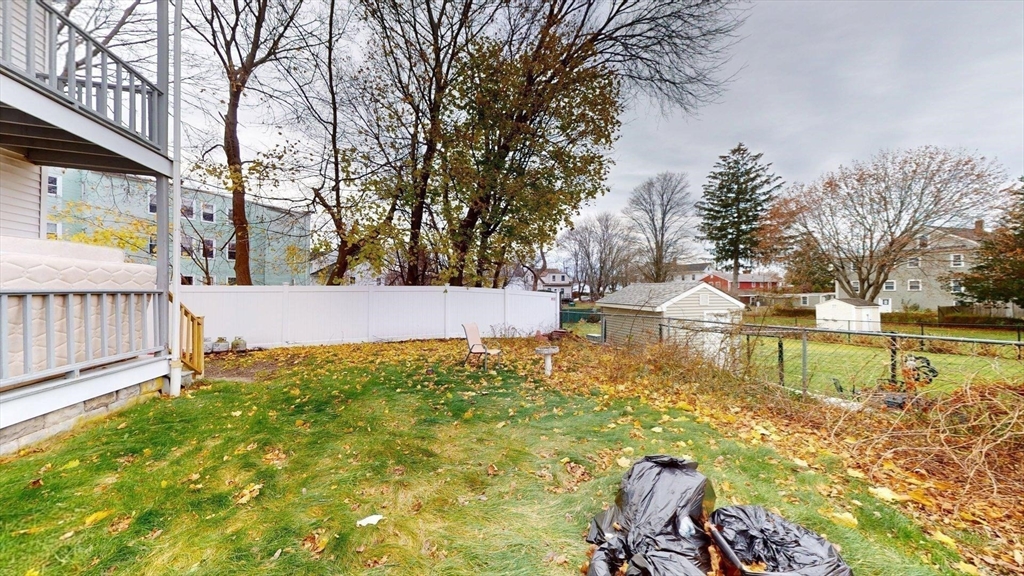 22 Summer Street, Unit 3 Stoughton, MA 02072 - Photo 4 of 4 a view of a lake with a house