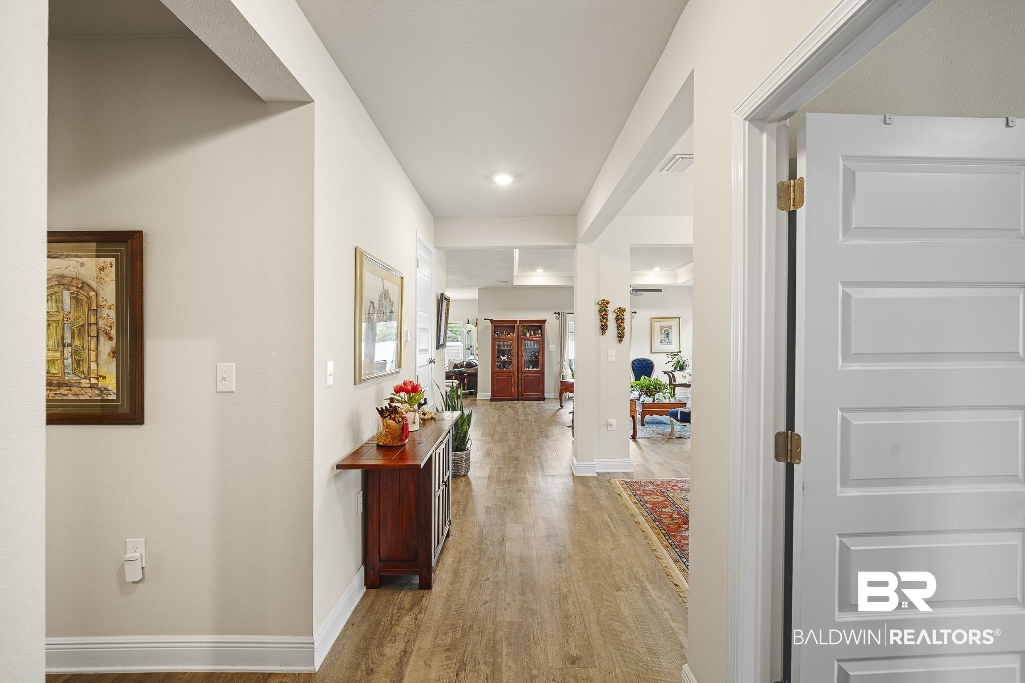 24765 Spectacular Bid Loop Daphne, AL 36526 - Photo 8 of 45 Hallway with light hardwood / wood-style floors