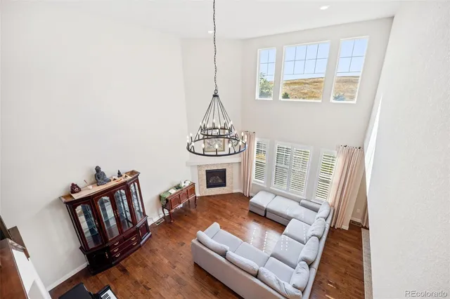 a view of a living room and wooden floor