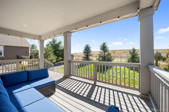 a view of a two chairs in the balcony