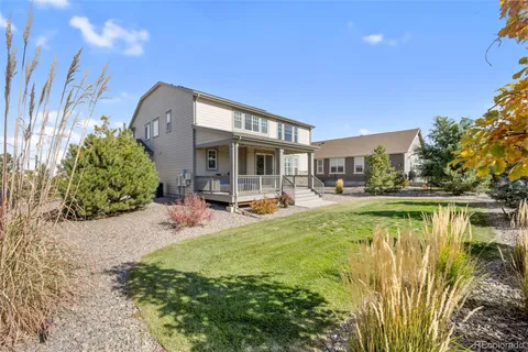 a view of swimming pool with outdoor seating and plants