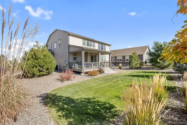 a view of swimming pool with outdoor seating and plants