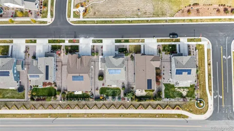 front view of white building with glass windows