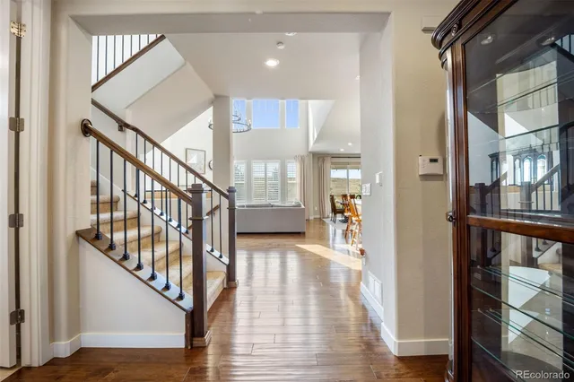 a view of an entryway with wooden floor and windows