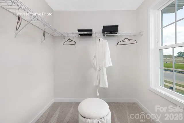 a bathroom with a toilet and a window