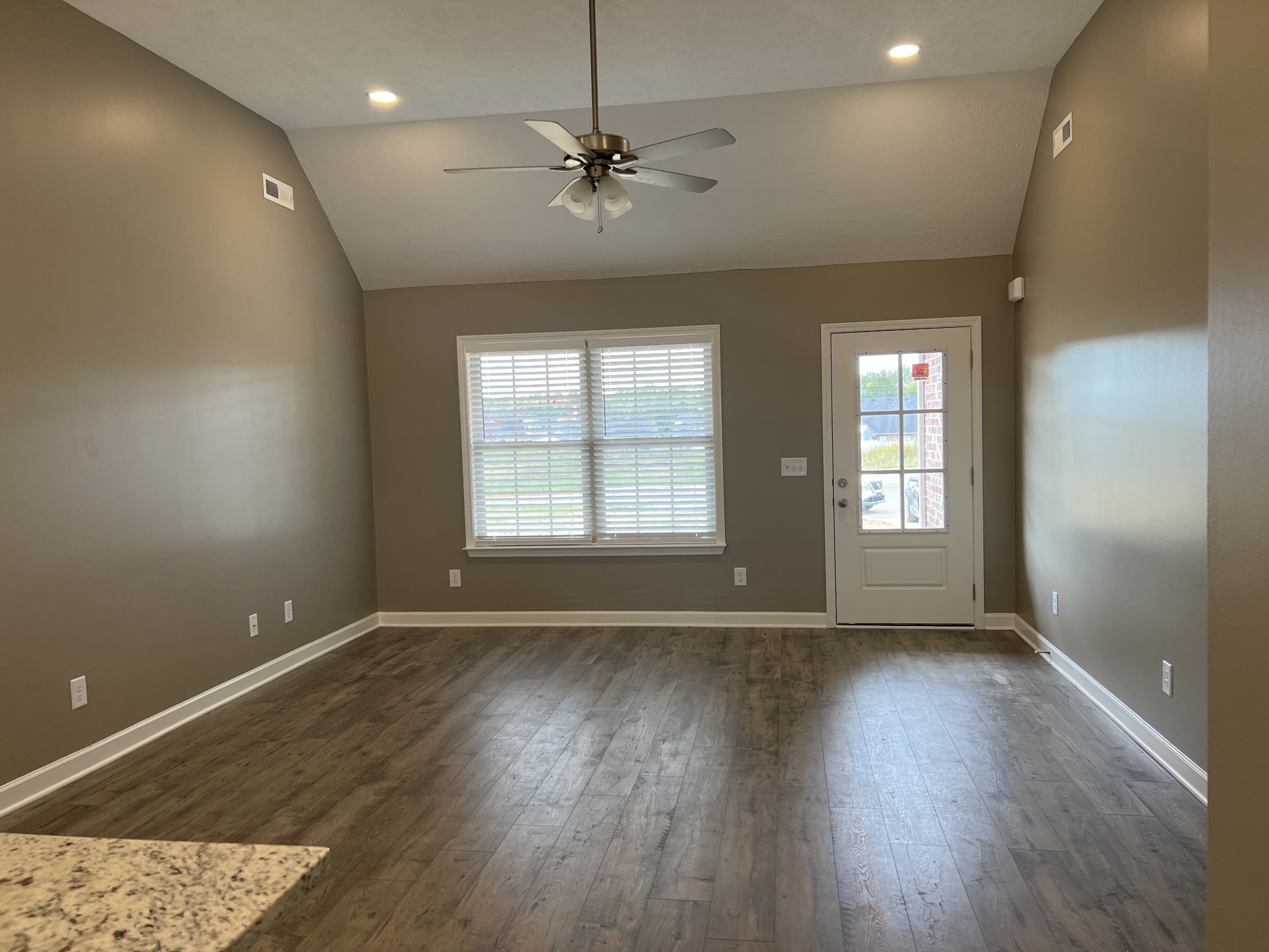 1 Dorsch Road Manchester, TN 37355 - Photo 3 of 11 a view of an empty room with a window and wooden floor