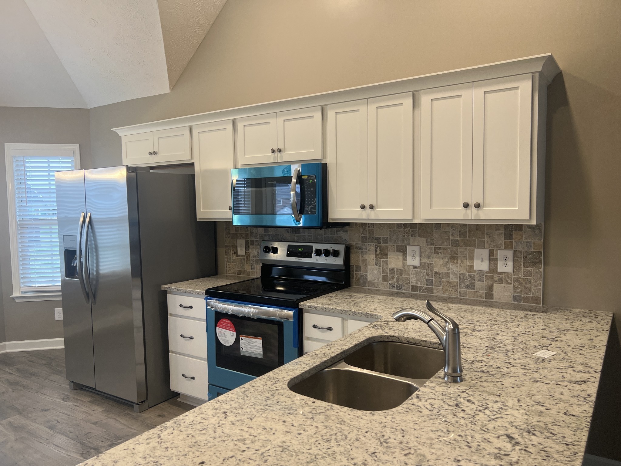 1 Dorsch Road Manchester, TN 37355 - Photo 9 of 11 a kitchen with stainless steel appliances granite countertop a refrigerator sink and stove