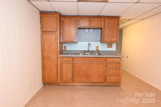 a white toilet sitting next to a bathroom sink