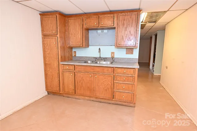 a bathroom with a sink a mirror and a window