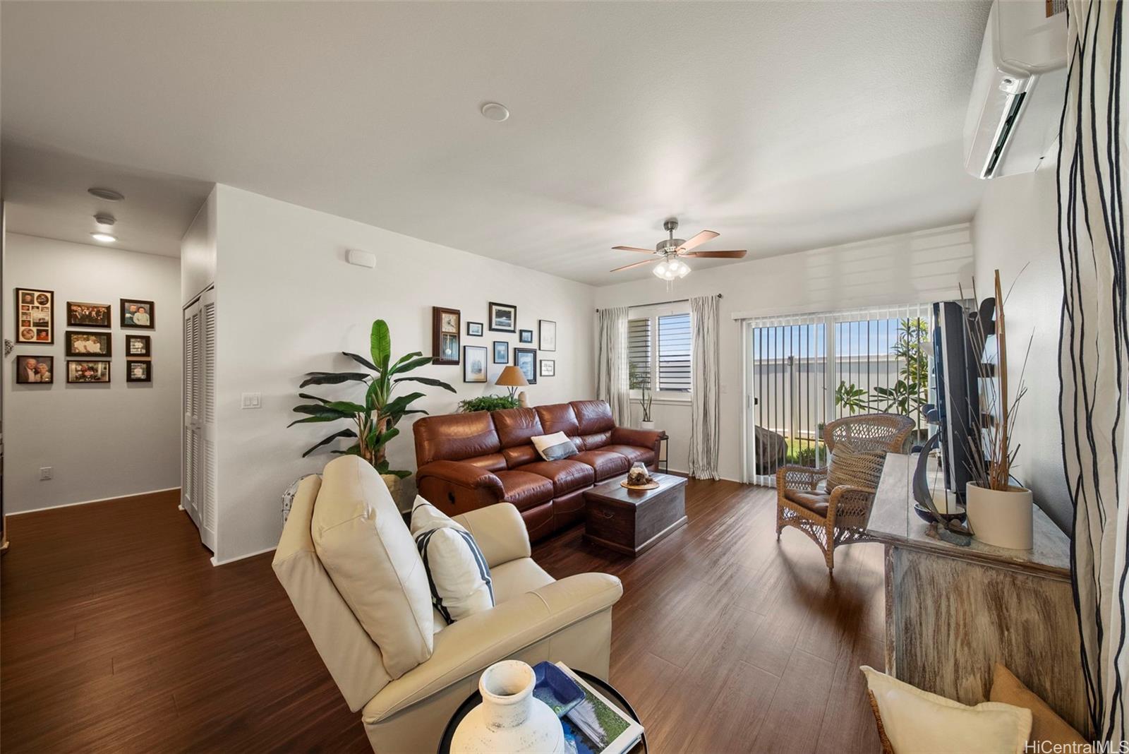 91-1129 Iliahialoe Loop Ewa Beach, HI 96706 - Photo 14 of 25 a living room with furniture and a chandelier