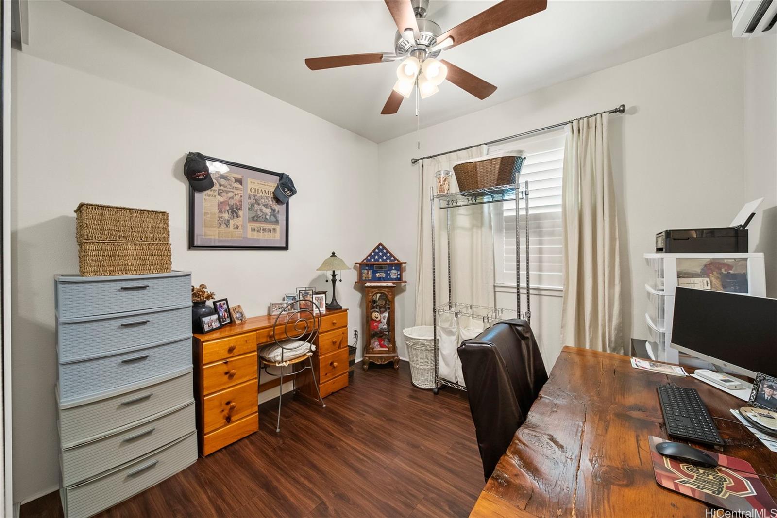 91-1129 Iliahialoe Loop Ewa Beach, HI 96706 - Photo 18 of 25 a bedroom with furniture and a window