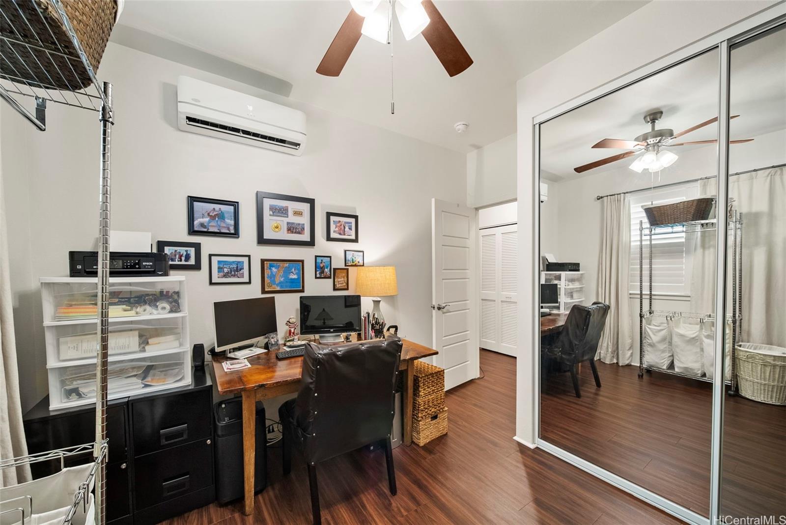 91-1129 Iliahialoe Loop Ewa Beach, HI 96706 - Photo 19 of 25 a view of a workspace with furniture and wooden floor