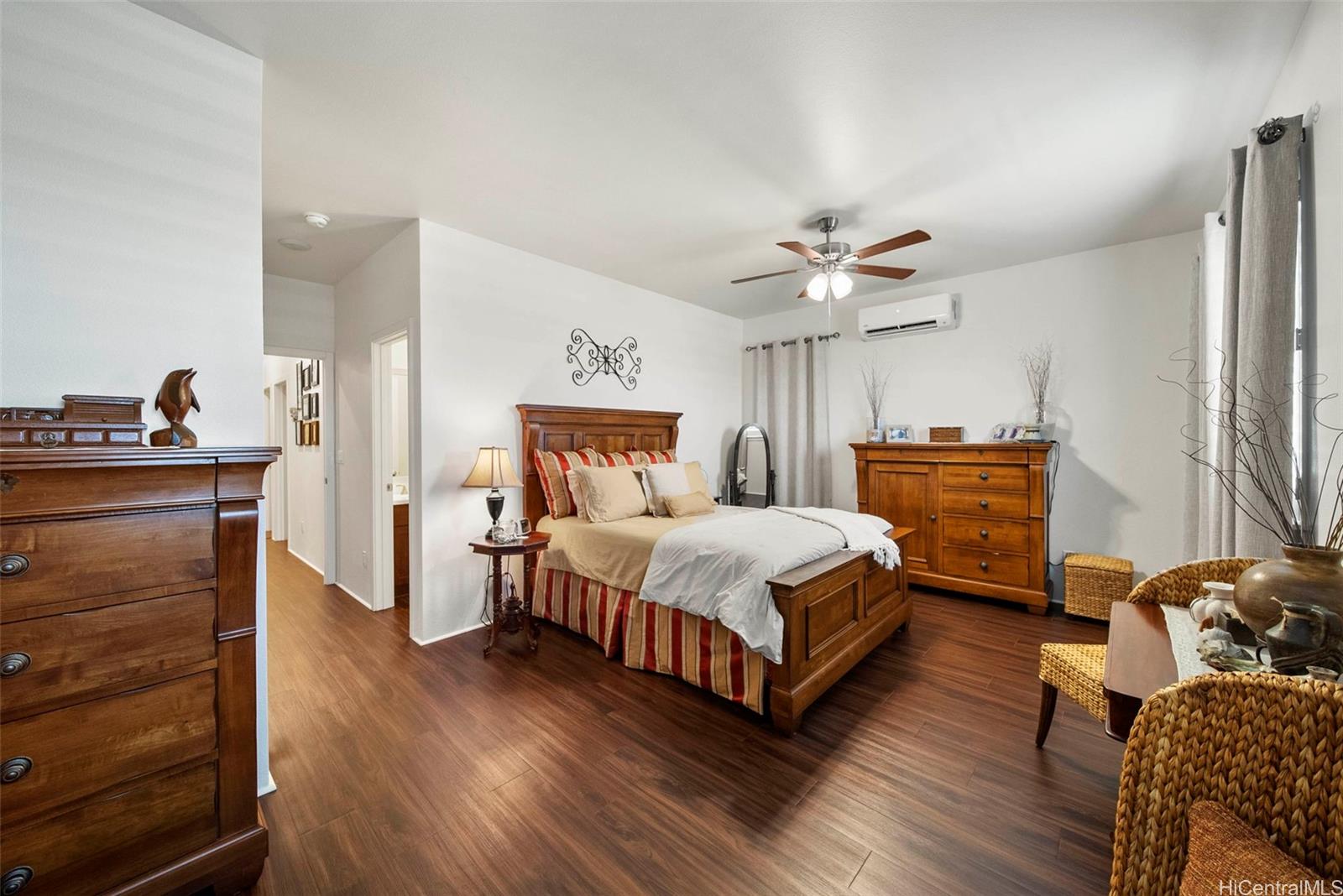91-1129 Iliahialoe Loop Ewa Beach, HI 96706 - Photo 22 of 25 a bedroom with a bed and a dresser