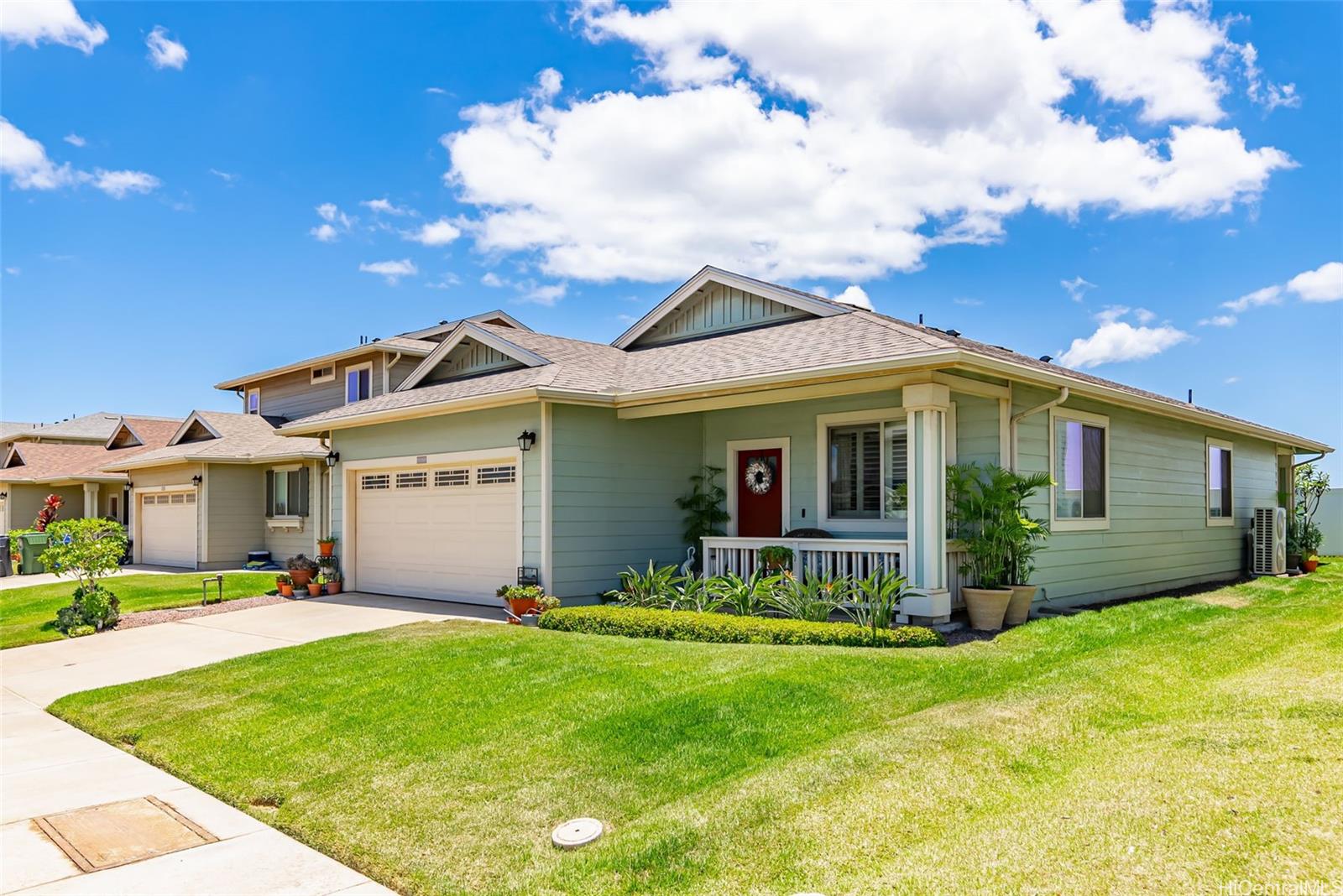 91-1129 Iliahialoe Loop Ewa Beach, HI 96706 - Photo 3 of 25 a view of a house with a big yard and large tree