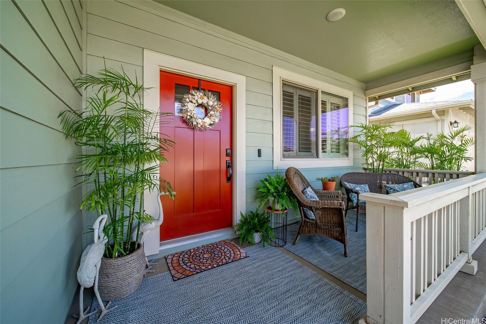 91-1129 Iliahialoe Loop Ewa Beach, HI 96706 - Photo 6 of 25 a house view with a seating space