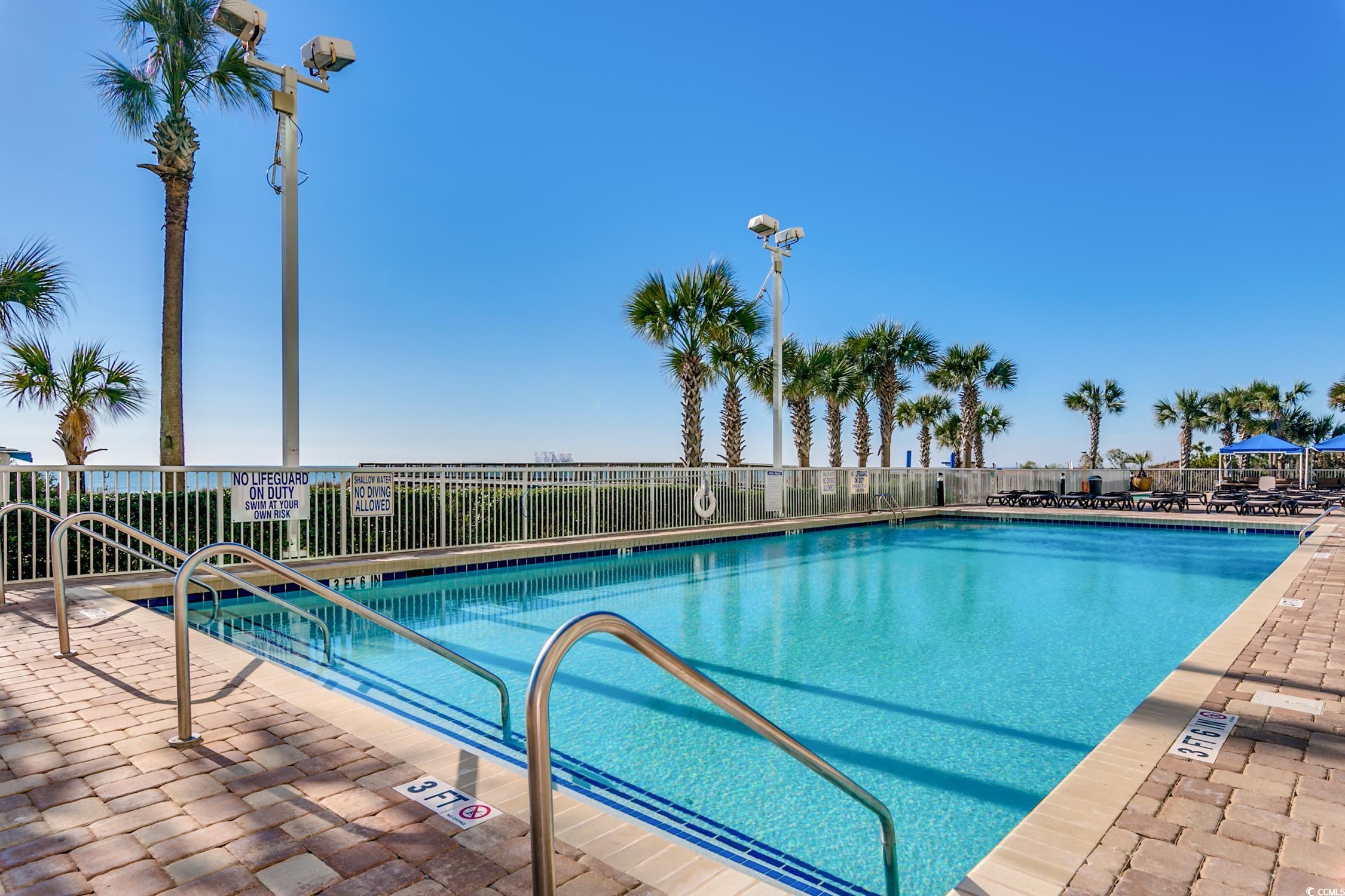 5200 North Ocean Boulevard, Unit 1037 Myrtle Beach, SC 29577 - Photo 25 of 40 Community pool featuring a patio area