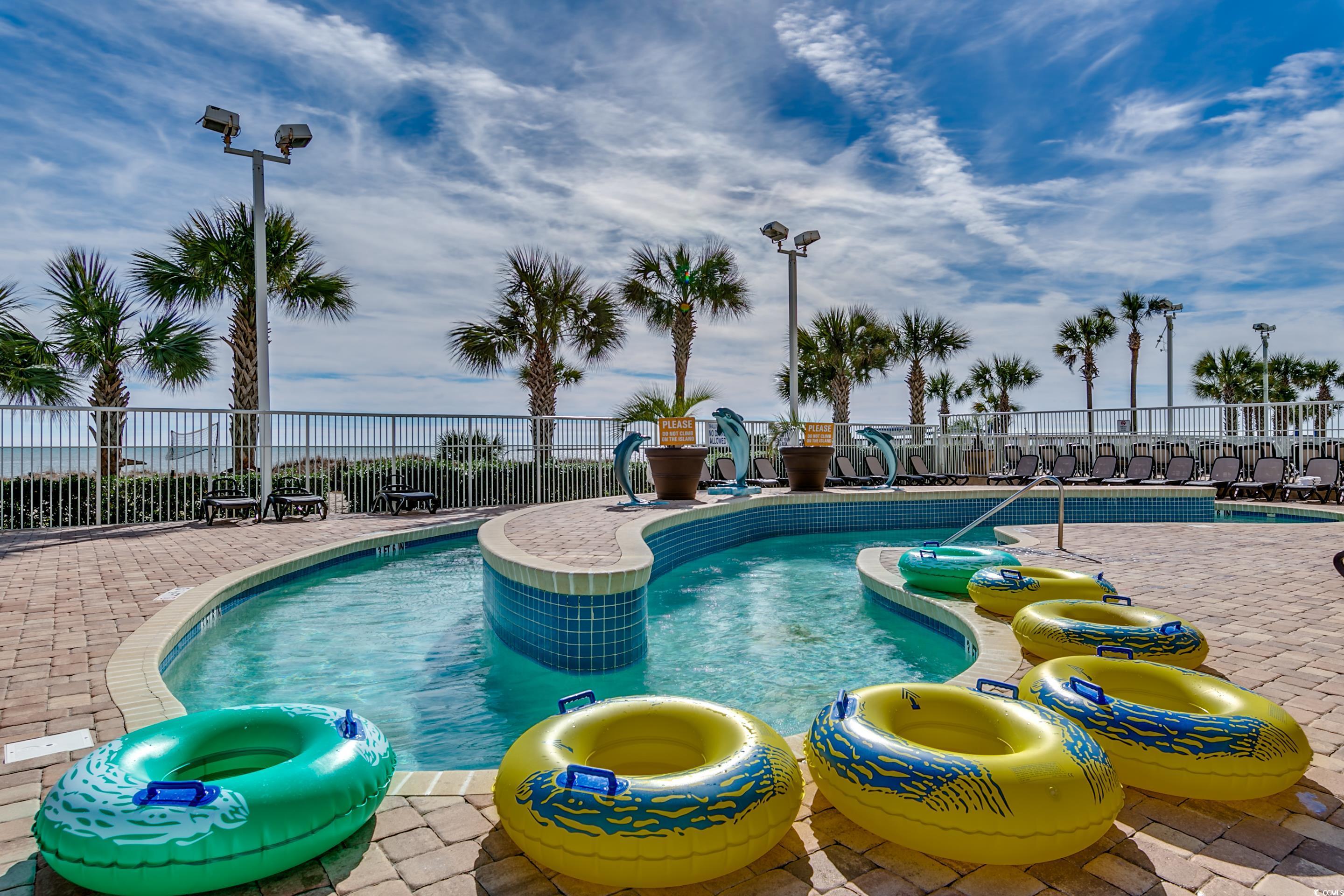 5200 North Ocean Boulevard, Unit 1037 Myrtle Beach, SC 29577 - Photo 26 of 40 Community pool featuring a patio
