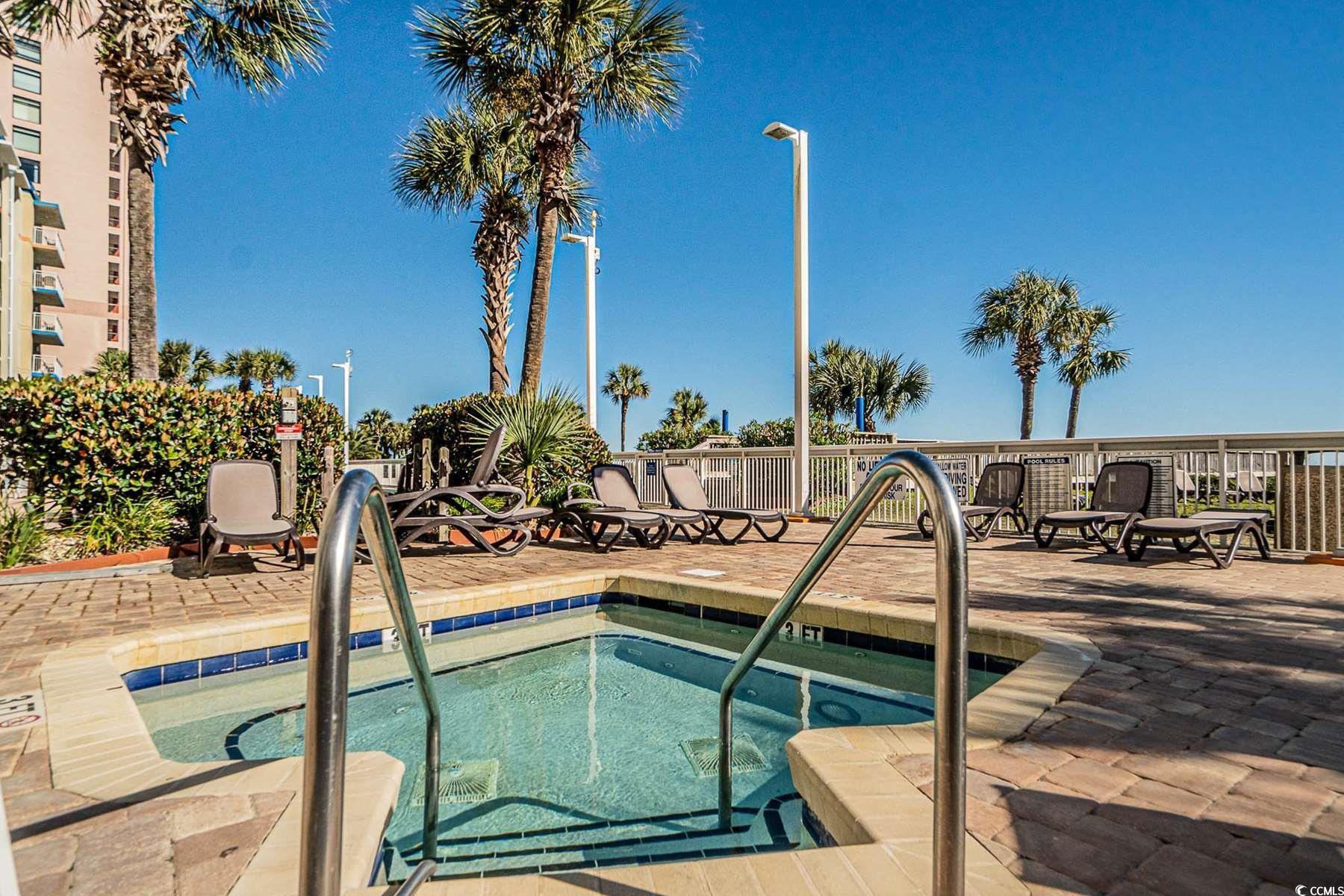 5200 North Ocean Boulevard, Unit 1037 Myrtle Beach, SC 29577 - Photo 27 of 40 View of pool with a hot tub, a patio area, and a pool