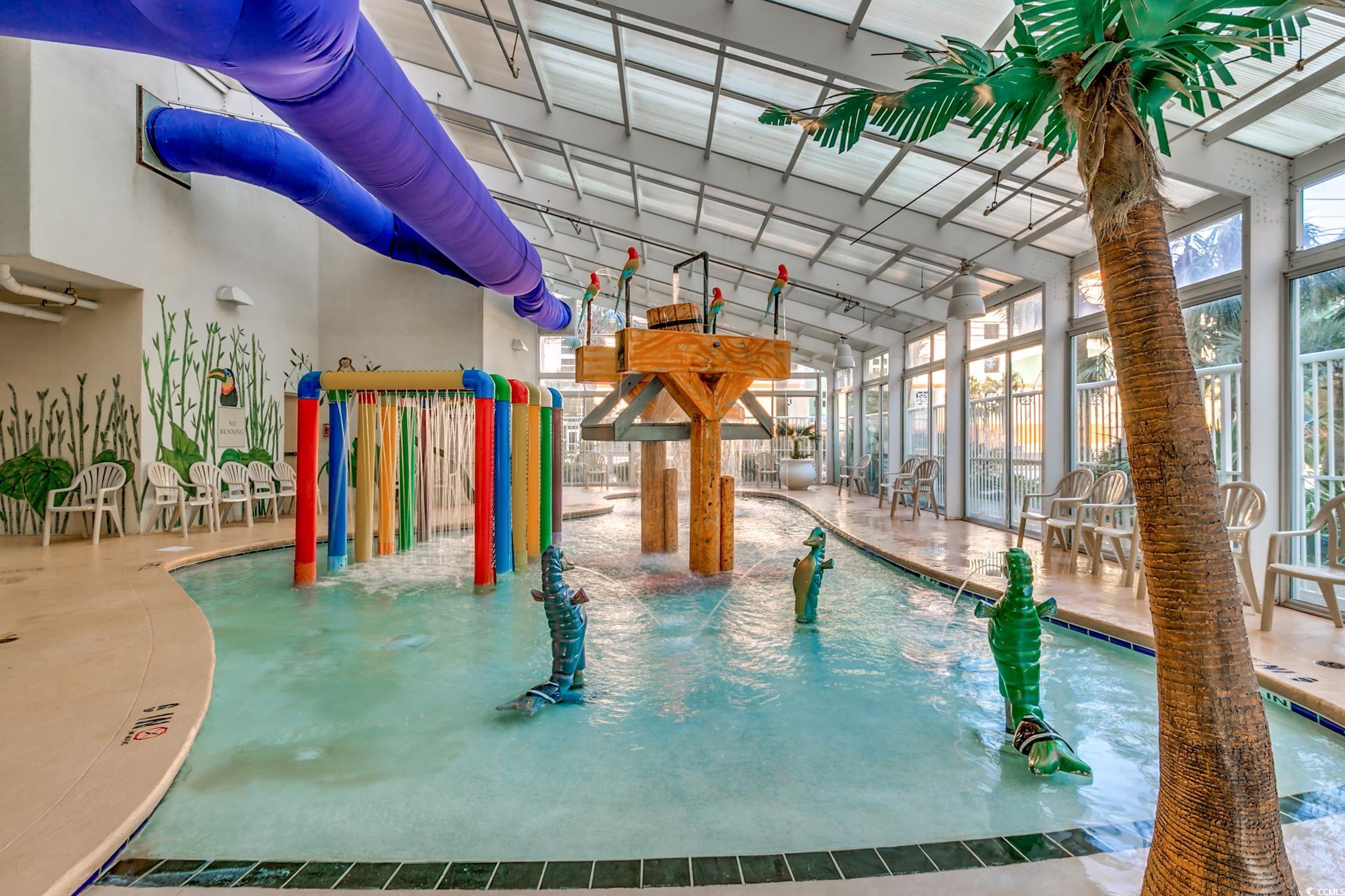 5200 North Ocean Boulevard, Unit 1037 Myrtle Beach, SC 29577 - Photo 30 of 40 Indoor community pool with a sunroom and a patio area