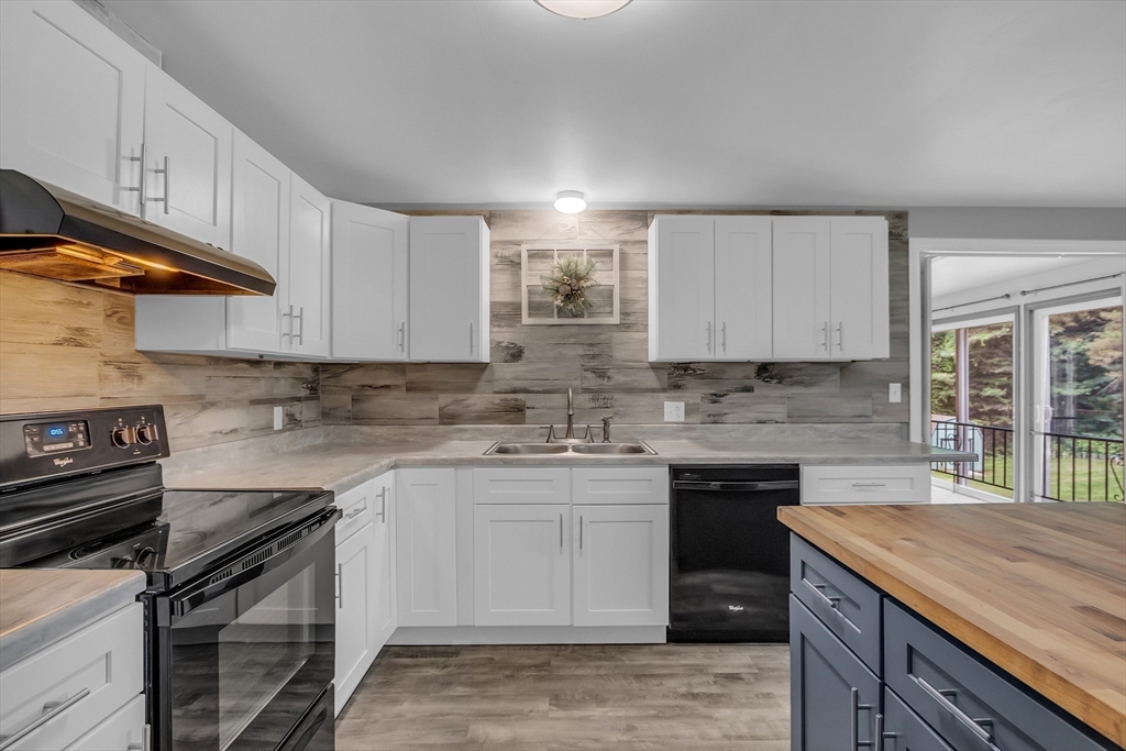 112 Walker Road Shirley, MA 01464 - Photo 12 of 33 a kitchen with stainless steel appliances granite countertop a sink stove and cabinets