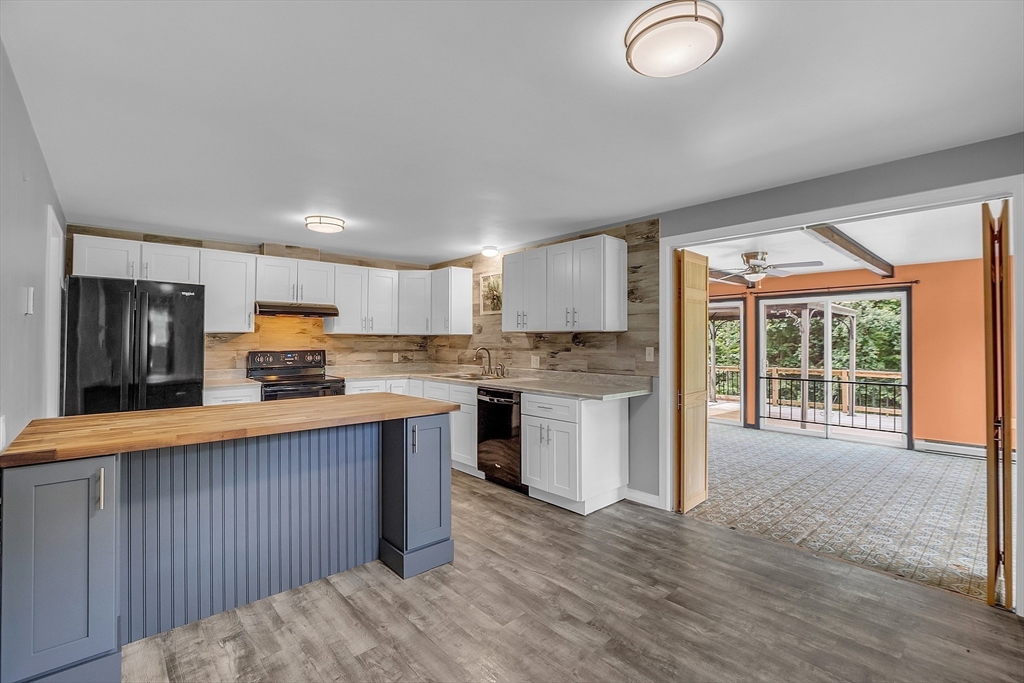 112 Walker Road Shirley, MA 01464 - Photo 13 of 33 a kitchen with stainless steel appliances granite countertop a refrigerator a sink dishwasher a stove and a refrigerator with wooden floor