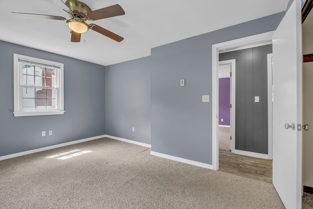 112 Walker Road Shirley, MA 01464 - Photo 18 of 33 an empty room with ceiling fan and window