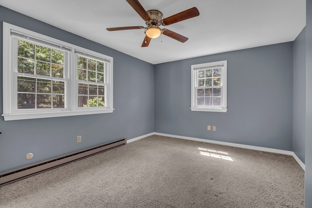 112 Walker Road Shirley, MA 01464 - Photo 19 of 33 an empty room with a window and a fan