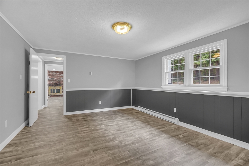 112 Walker Road Shirley, MA 01464 - Photo 26 of 33 a view of empty room with a window and wooden floor