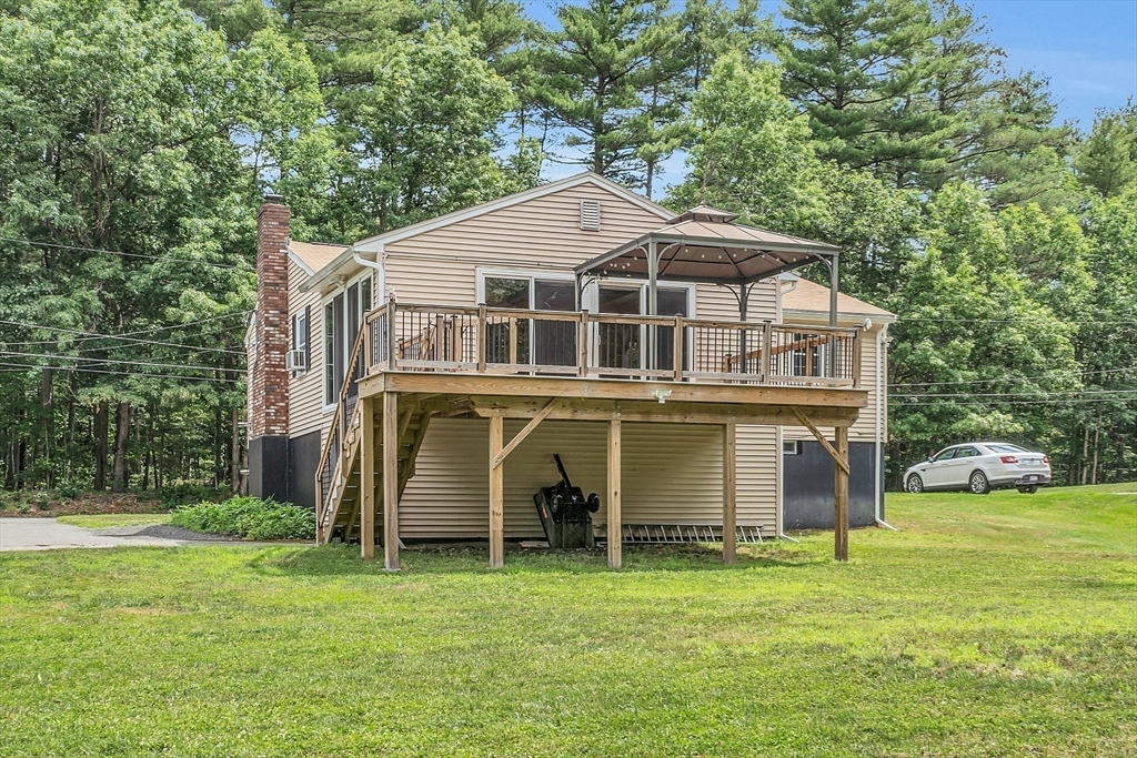 112 Walker Road Shirley, MA 01464 - Photo 3 of 33 a view of a big house with a big yard and large trees