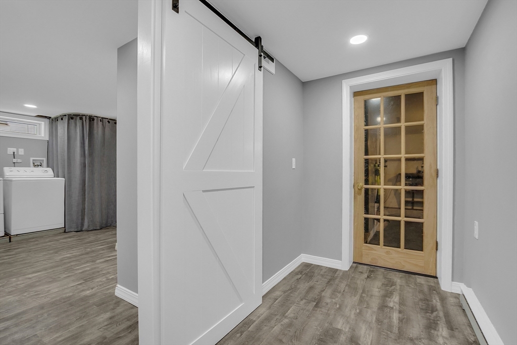 112 Walker Road Shirley, MA 01464 - Photo 32 of 33 a view of an empty room with wooden floor and a window