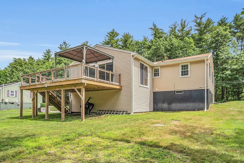 112 Walker Road Shirley, MA 01464 - Photo 4 of 33 a house view with a garden space
