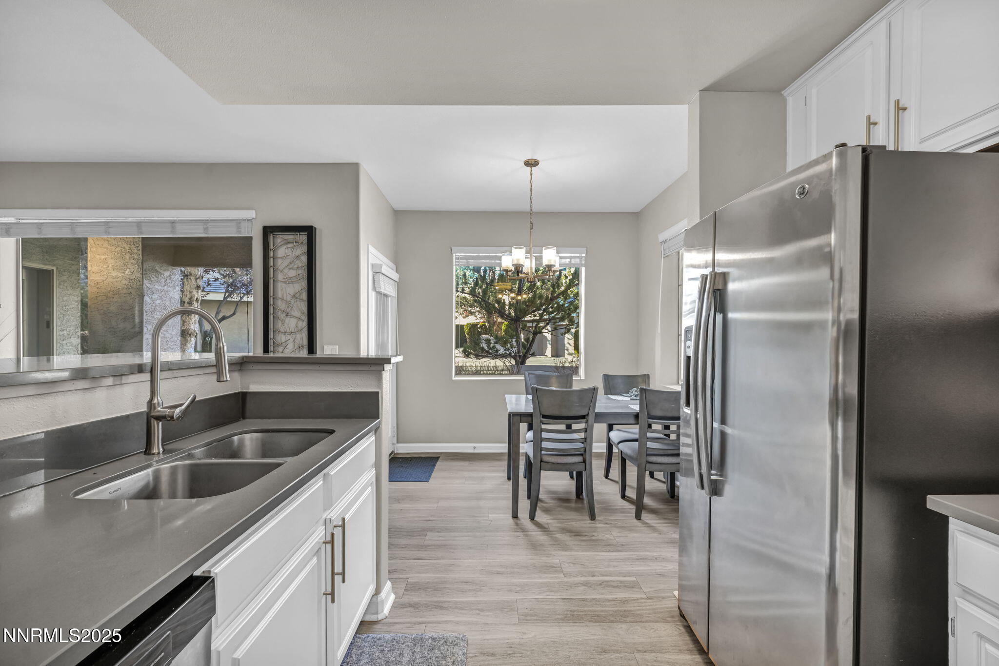900 South Meadows Parkway, Unit 814 Reno, NV 89521 - Photo 12 of 43 a kitchen with kitchen island a counter top space a sink stainless steel appliances and cabinets