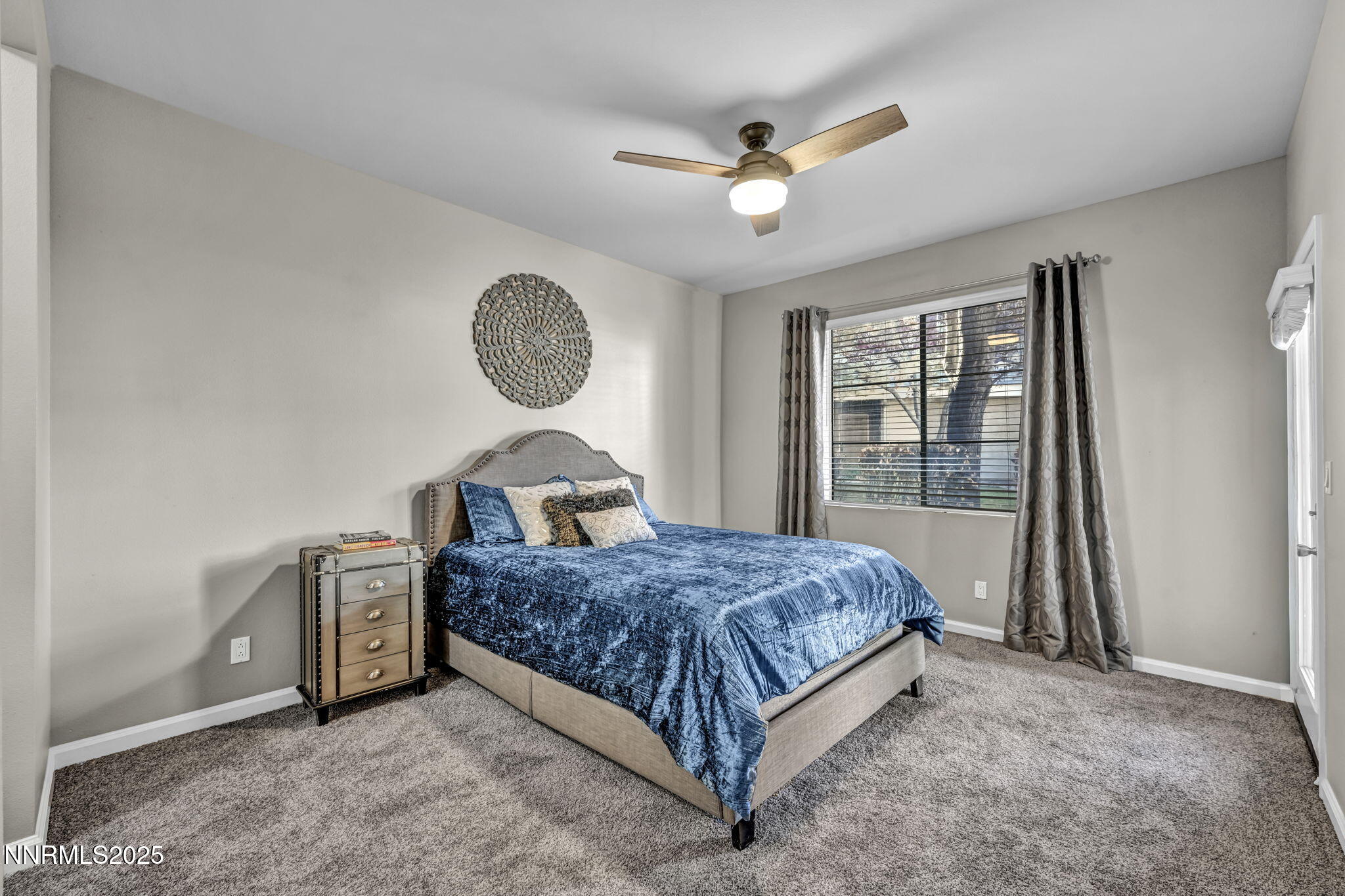 900 South Meadows Parkway, Unit 814 Reno, NV 89521 - Photo 14 of 43 a bedroom with a bed chandelier and a window