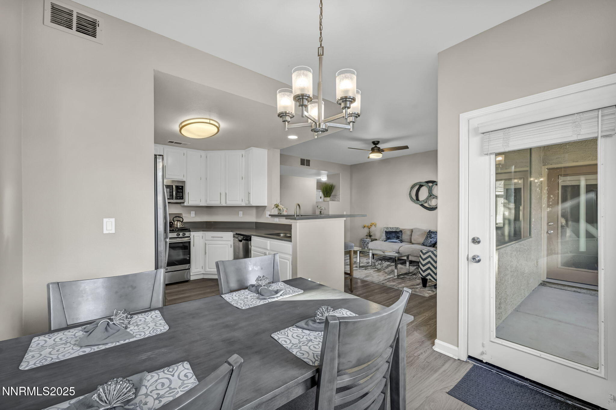 900 South Meadows Parkway, Unit 814 Reno, NV 89521 - Photo 16 of 43 a very nice looking dining room with a table and chairs