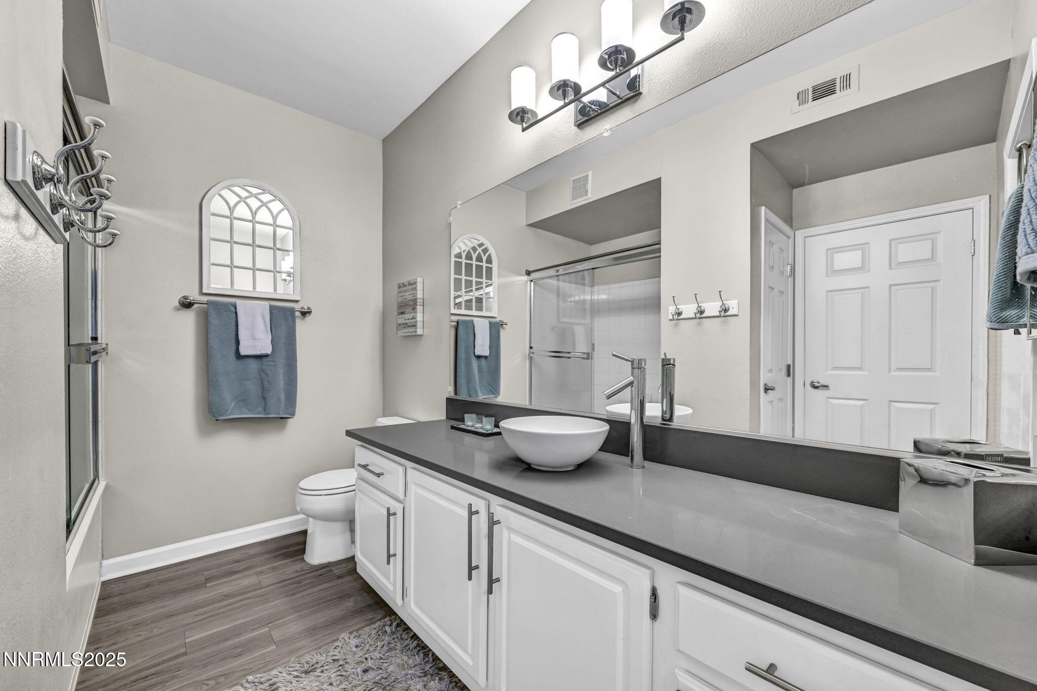 900 South Meadows Parkway, Unit 814 Reno, NV 89521 - Photo 19 of 43 a spacious bathroom with a granite countertop sink a toilet and a mirror
