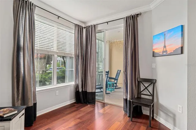 a view of an entryway with wooden floor and a window