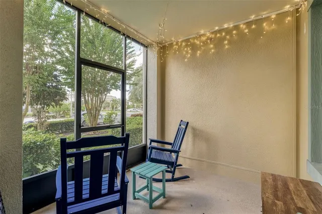 a view of a room with furniture and a window