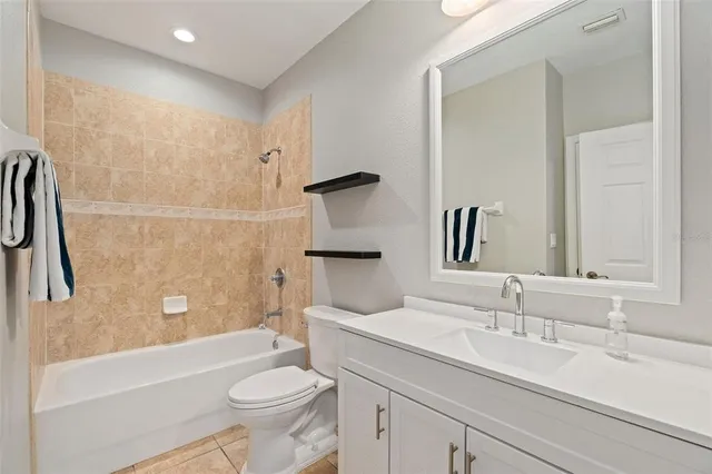 a bathroom with a sink a toilet and a bathtub