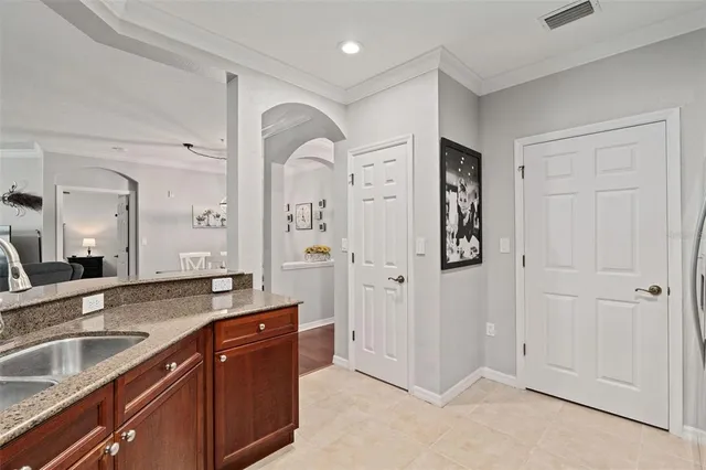 a spacious bathroom with a granite countertop sink mirror and shower