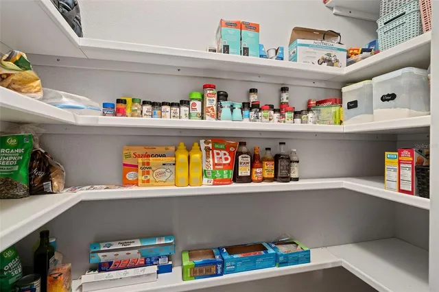a cabinet with a book shelf and a shelf